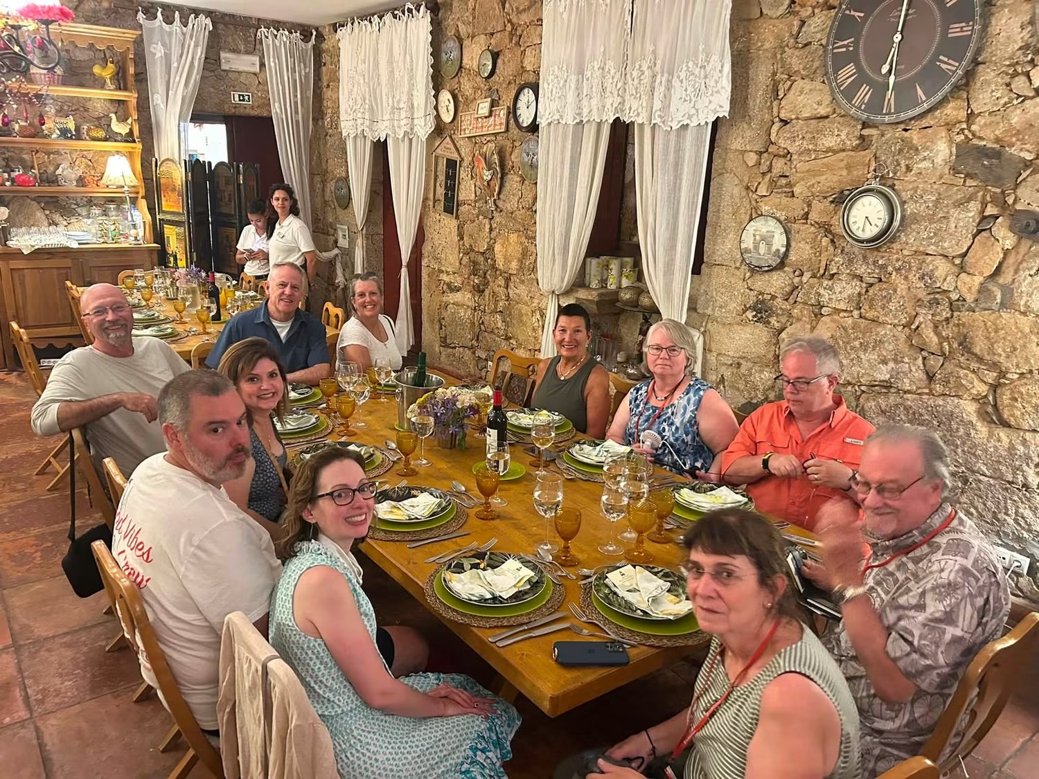 Winery group sharing a wine-country dinner in Europe